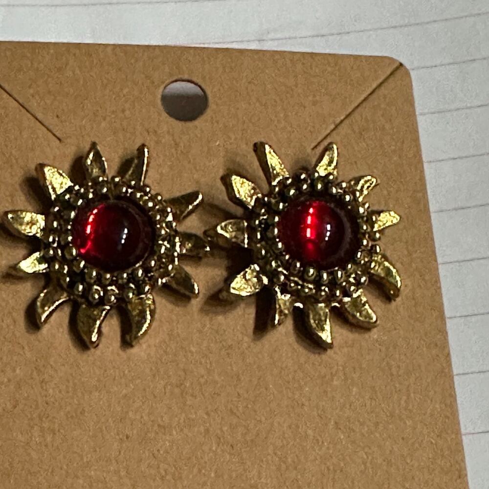 Golden sun with red gem pierced earrings